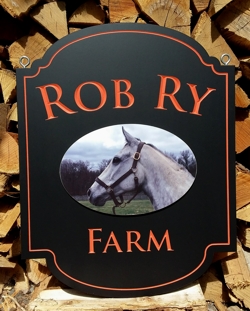 Custom farm sign in rich red and gold leaf carved letters